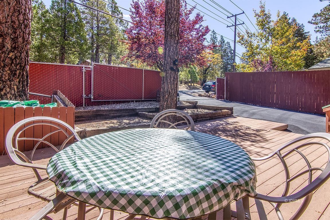 26833 Idyllwild Road Idyllwild, CA 92549 - Photo 9 of 38 a backyard of a house with table and chairs