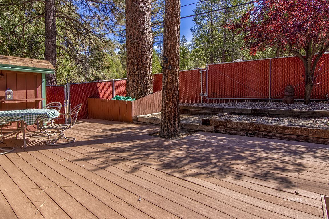 26833 Idyllwild Road Idyllwild, CA 92549 - Photo 10 of 38 a view of backyard with wooden fence and large trees