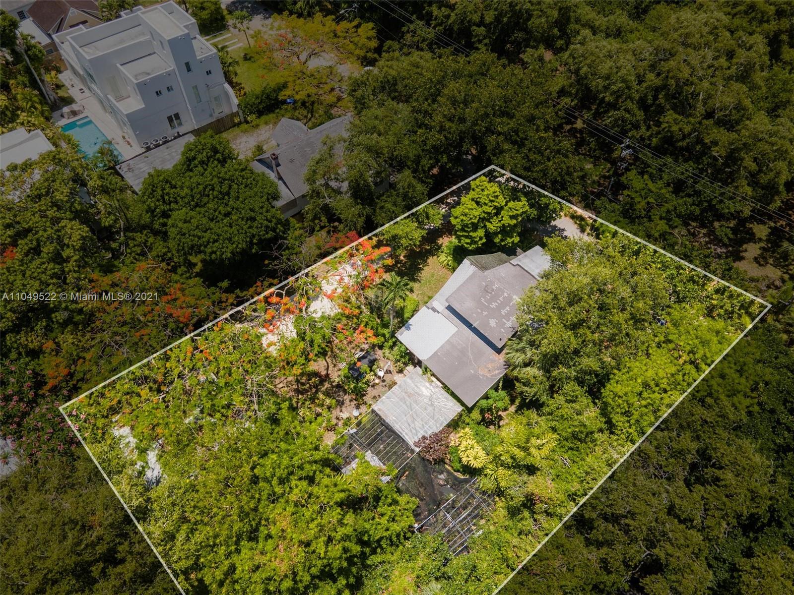 720 Northeast 68th Street Miami, FL 33138 - Photo 5 of 8 an aerial view of house with yard and swimming pool