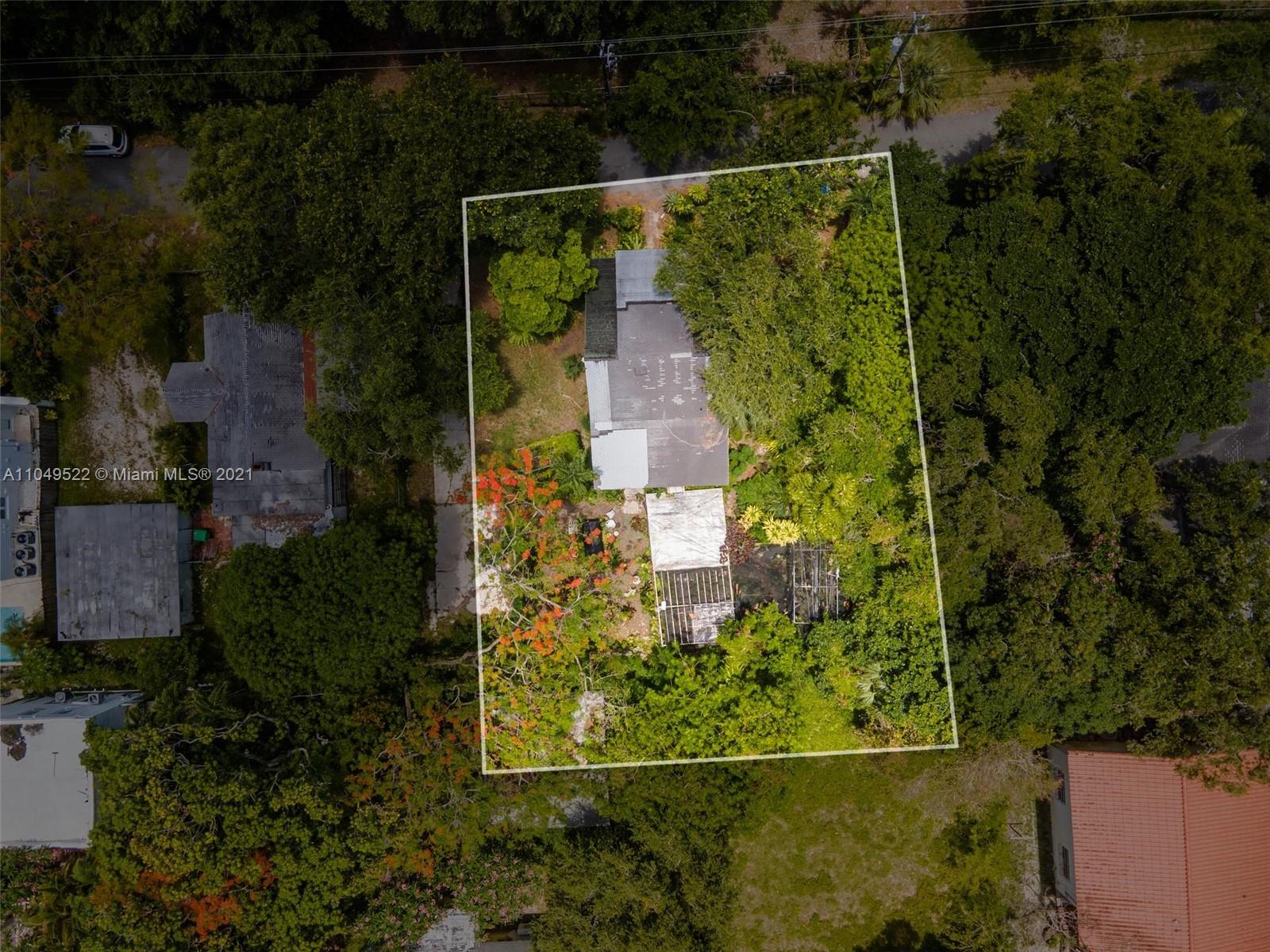 720 Northeast 68th Street Miami, FL 33138 - Photo 6 of 8 an aerial view of residential house with outdoor space and trees all around