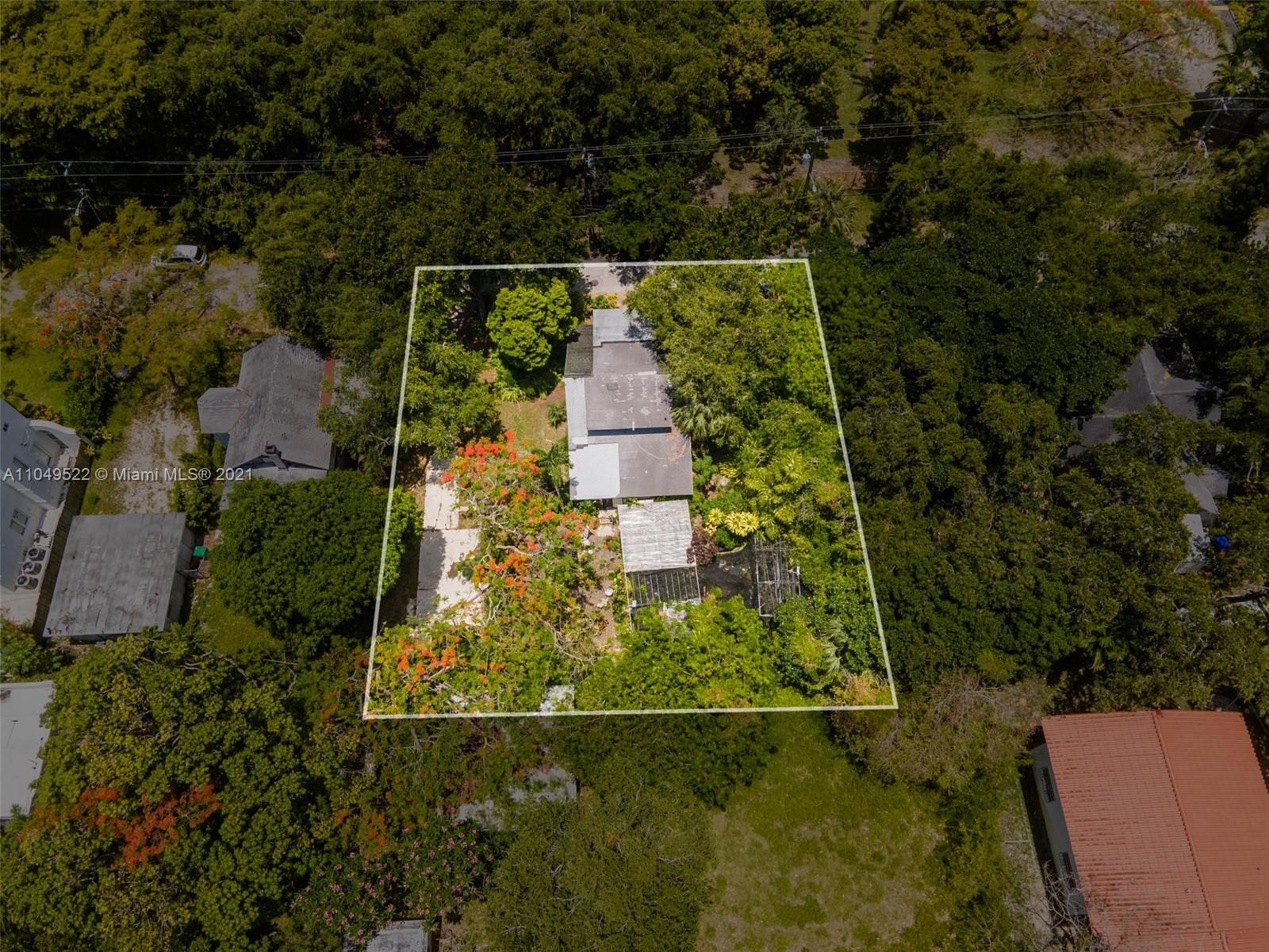 720 Northeast 68th Street Miami, FL 33138 - Photo 7 of 8 an aerial view of a house with a yard