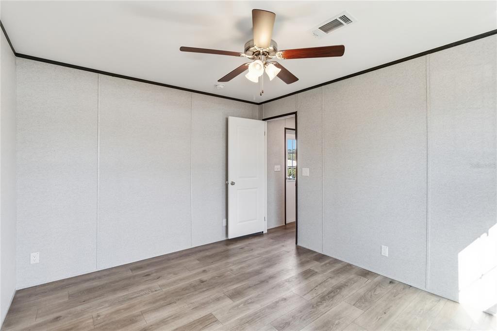 2003 Oak Street St. Cloud, FL 34769 - Photo 13 of 20 a view of a room with wooden floor