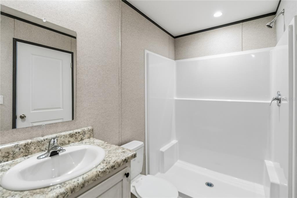 2003 Oak Street St. Cloud, FL 34769 - Photo 17 of 21 a bathroom with a sink toilet and shower