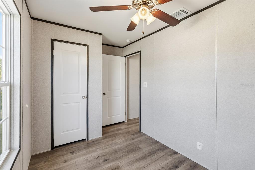 2003 Oak Street St. Cloud, FL 34769 - Photo 18 of 20 a view of an empty room with wooden floor