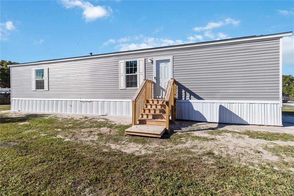 2003 Oak Street St. Cloud, FL 34769 - Photo 2 of 21 a view of a house with a yard