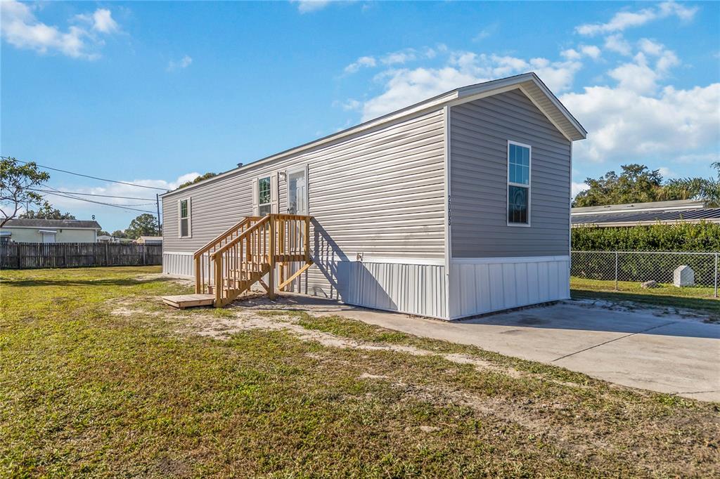 2003 Oak Street St. Cloud, FL 34769 - Photo 3 of 21 a view of a house with a yard