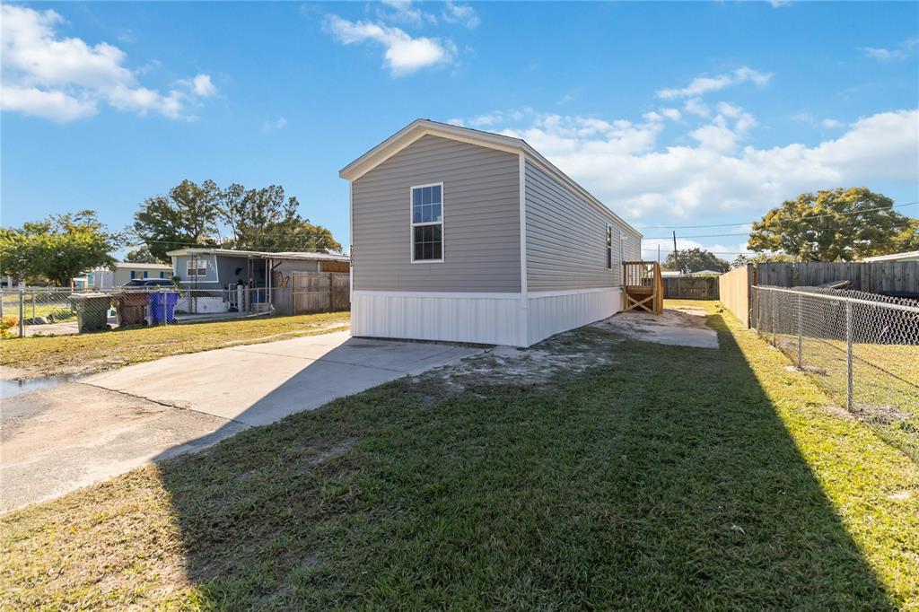 2003 Oak Street St. Cloud, FL 34769 - Photo 4 of 21 a view of a house with a yard