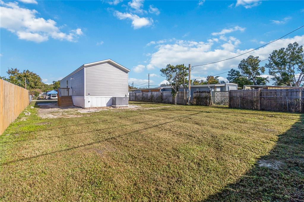2003 Oak Street St. Cloud, FL 34769 - Photo 6 of 21 a view of a house with a yard