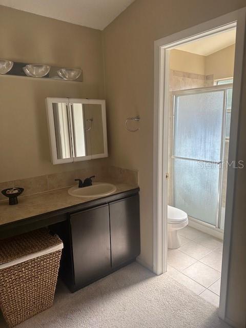 1793 Hampton Lane, Unit 110 Palm Harbor, FL 34683 - Photo 11 of 35 a bathroom with a sink a toilet and mirror