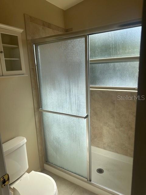 1793 Hampton Lane, Unit 110 Palm Harbor, FL 34683 - Photo 13 of 35 a bathroom with a glass shower door