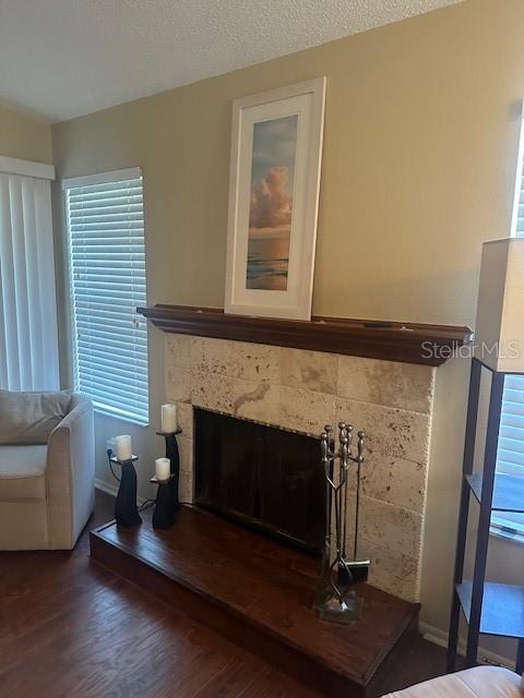 1793 Hampton Lane, Unit 110 Palm Harbor, FL 34683 - Photo 16 of 35 a living room with furniture and a fireplace