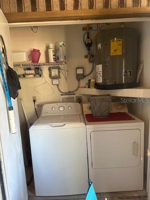 1793 Hampton Lane, Unit 110 Palm Harbor, FL 34683 - Photo 18 of 35 a utility room with dryer and washer