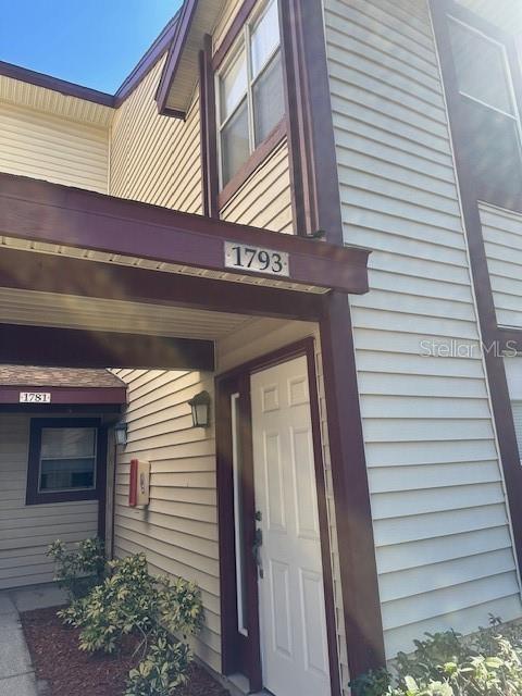 1793 Hampton Lane, Unit 110 Palm Harbor, FL 34683 - Photo 2 of 35 a view of a entryway door of the house