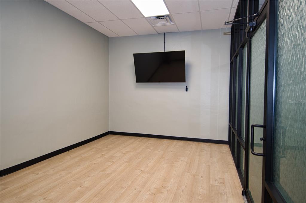 1793 Hampton Lane, Unit 110 Palm Harbor, FL 34683 - Photo 23 of 35 a view of a livingroom with a flat screen tv