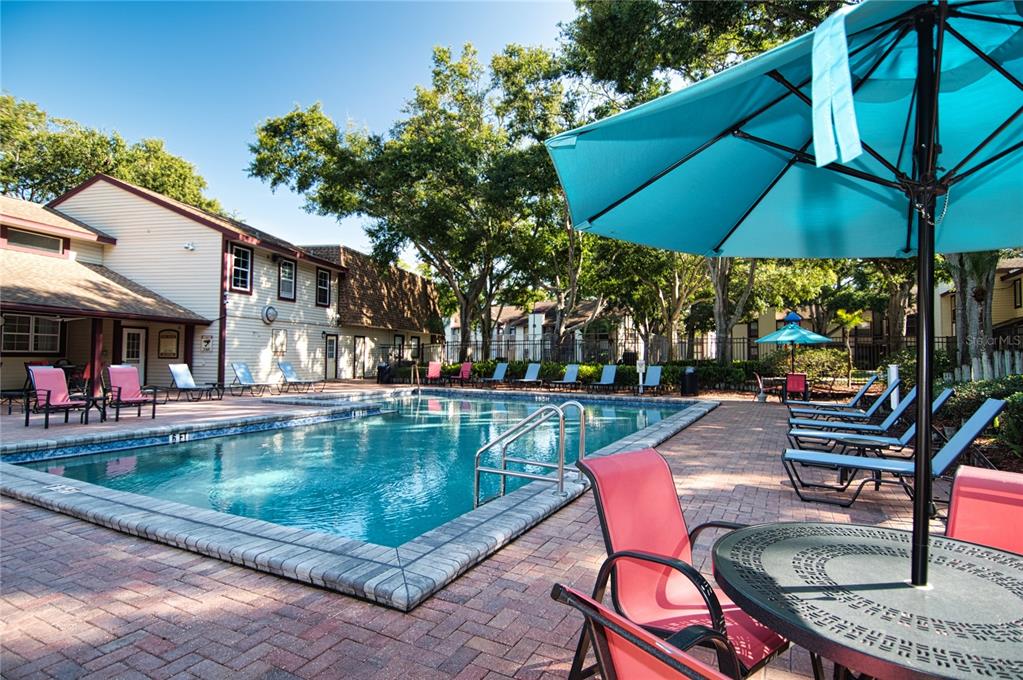 1793 Hampton Lane, Unit 110 Palm Harbor, FL 34683 - Photo 25 of 35 a view of swimming pool with outdoor seating