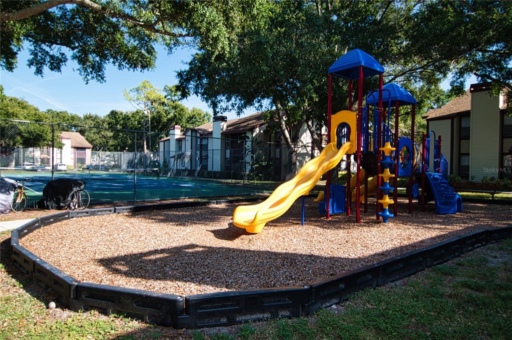 1793 Hampton Lane, Unit 110 Palm Harbor, FL 34683 - Photo 30 of 35 a view of a house with swimming pool and sitting area