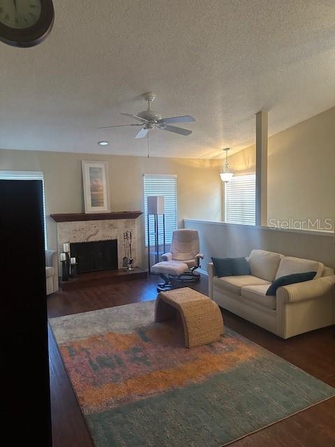1793 Hampton Lane, Unit 110 Palm Harbor, FL 34683 - Photo 4 of 35 a living room with furniture and a fireplace