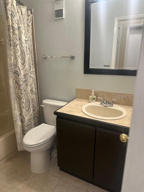 1793 Hampton Lane, Unit 110 Palm Harbor, FL 34683 - Photo 8 of 35 a bathroom with a sink toilet and mirror