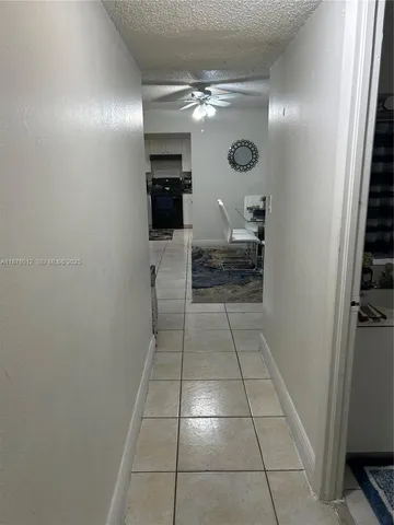 a kitchen with a sink a stove and cabinets