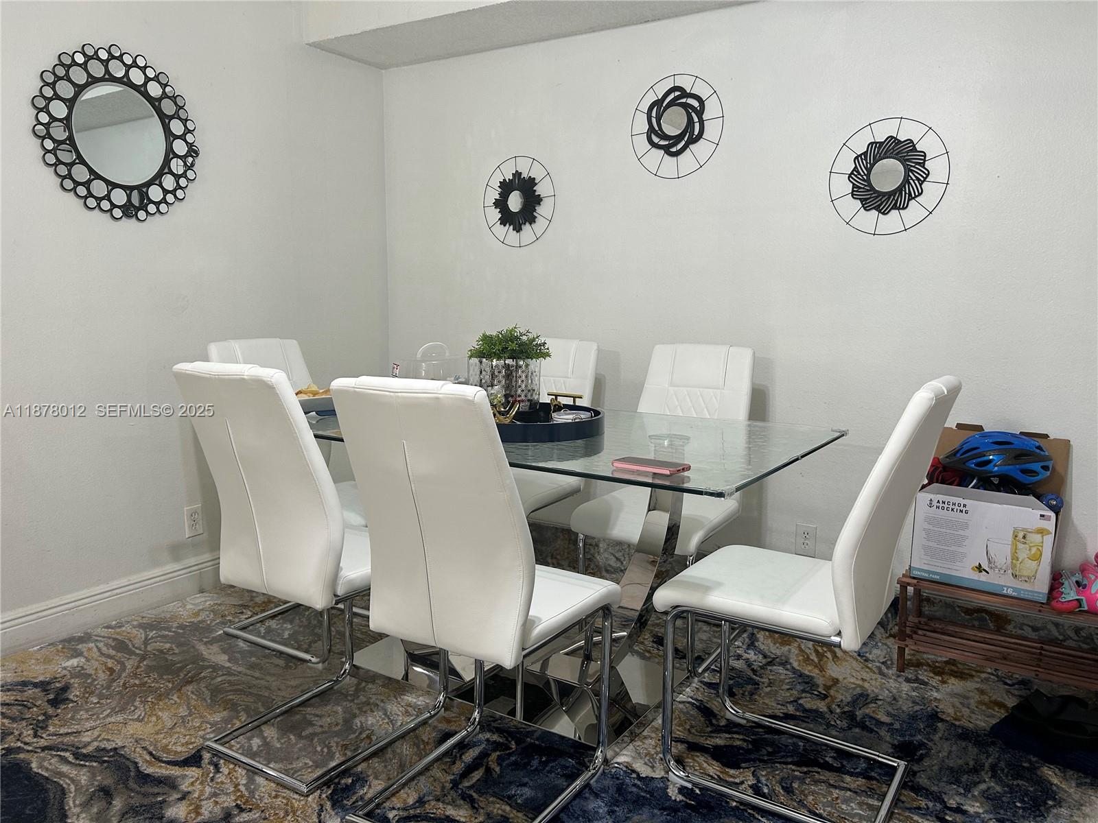 17901 Northwest 68th Avenue, Unit T101 Hialeah, FL 33015 - Photo 2 of 45 a view of a dining room with furniture