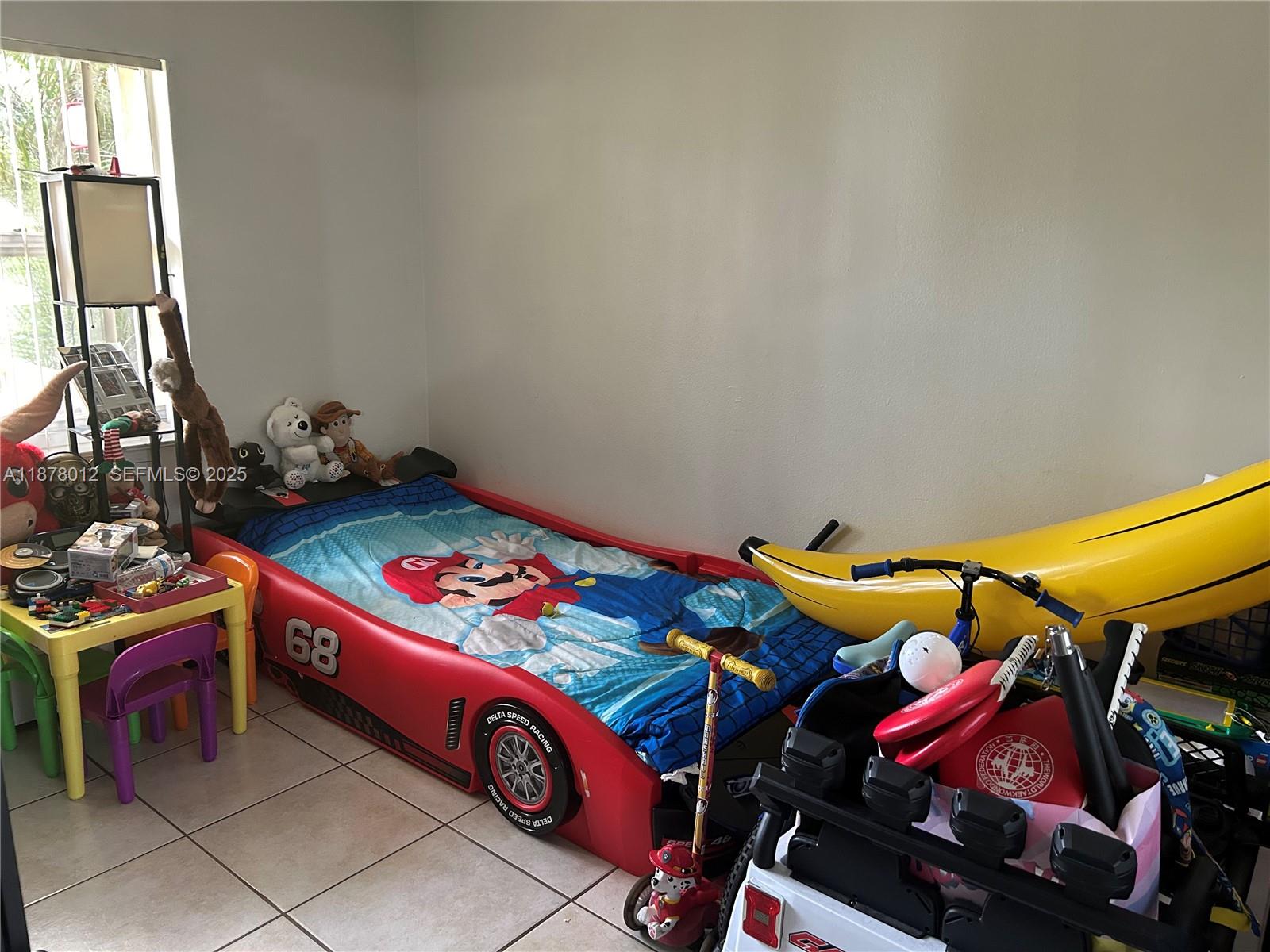 17901 Northwest 68th Avenue, Unit T101 Hialeah, FL 33015 - Photo 8 of 45 a utility room with dryer and bicycles