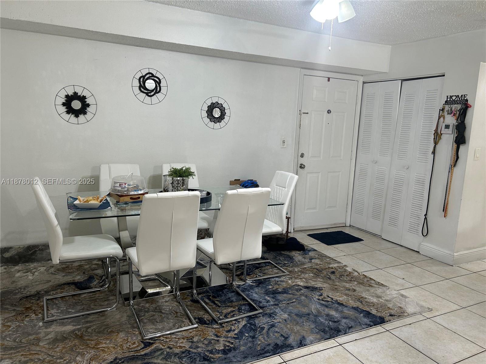 17901 Northwest 68th Avenue, Unit T101 Hialeah, FL 33015 - Photo 9 of 45 a view of a dining room with furniture