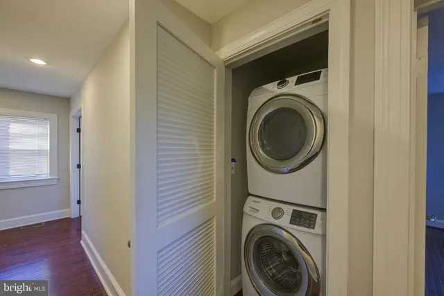 a view of a hallway with washer and dryer