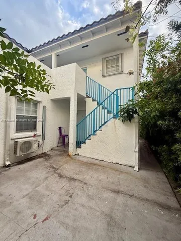 a view of a house with a yard and garage