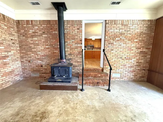 a view of a room with a floor to ceiling window and stairs