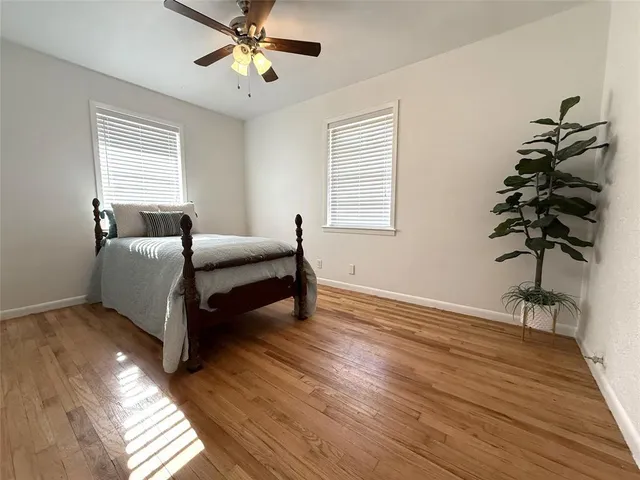a bedroom with furniture and a potted plant
