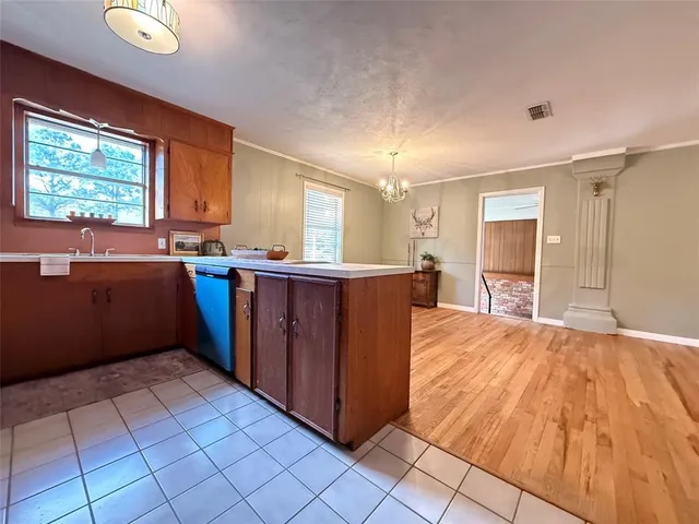 a view of kitchen with sink and window