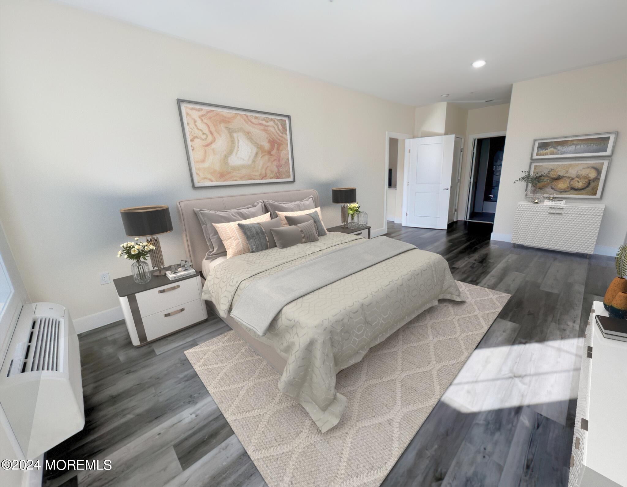 126 Main Street, Unit 410 Matawan, NJ 07747 - Photo 5 of 13 a bed room with a bed and a painting on the wall