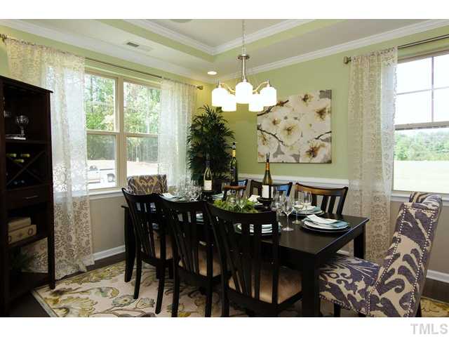 2421 Pilsley Road Apex, NC 27539 - Photo 3 of 25 a view of a dining room with furniture and window