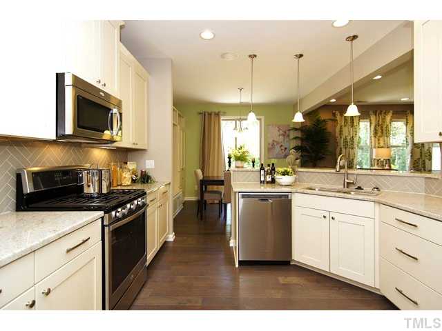 2421 Pilsley Road Apex, NC 27539 - Photo 8 of 25 a kitchen with a sink stove and microwave