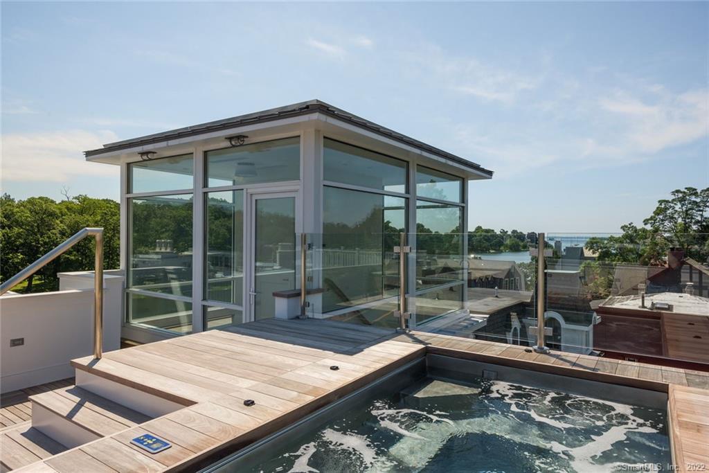 a wooden bench sitting in front of a building