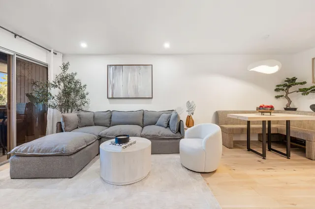 a living room with furniture and a table