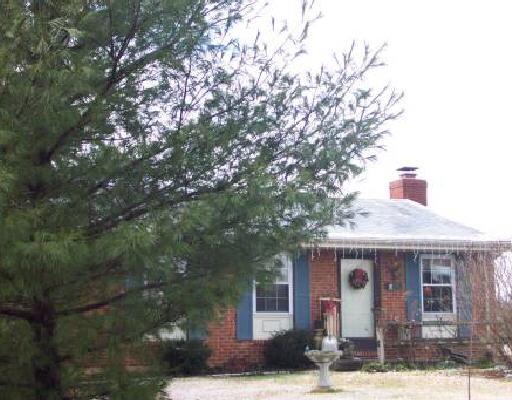 5534 Cove Road Roanoke, VA 24019 - Photo 1 of 1 a front view of a house with garden