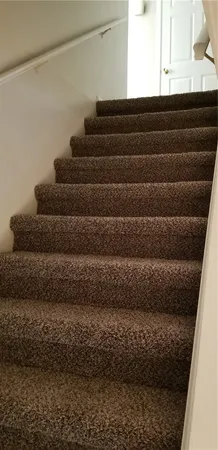 a view of an empty room and a window