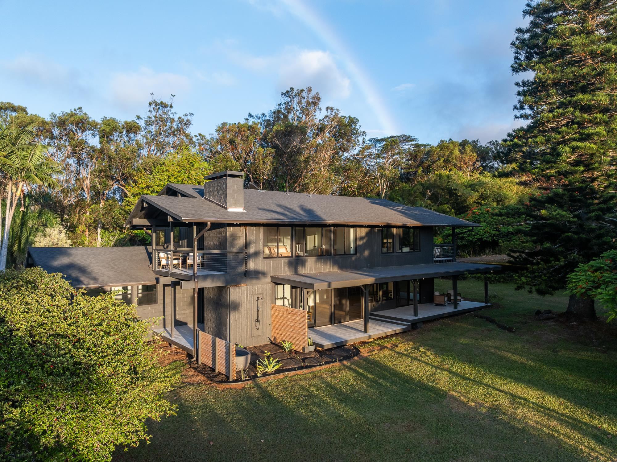 965 Hog Back Road Haiku, HI 96708 - Photo 42 of 44 an aerial view of a house with table and chairs under an umbrella