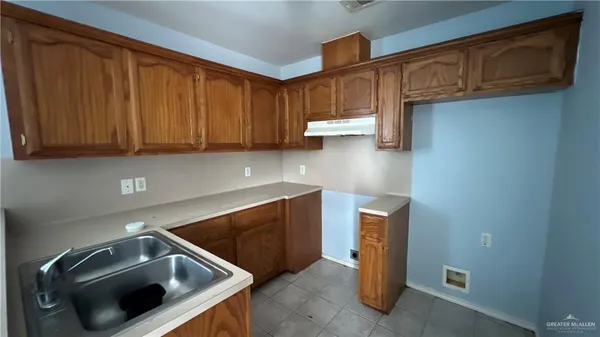 a kitchen with a sink and a cabinets