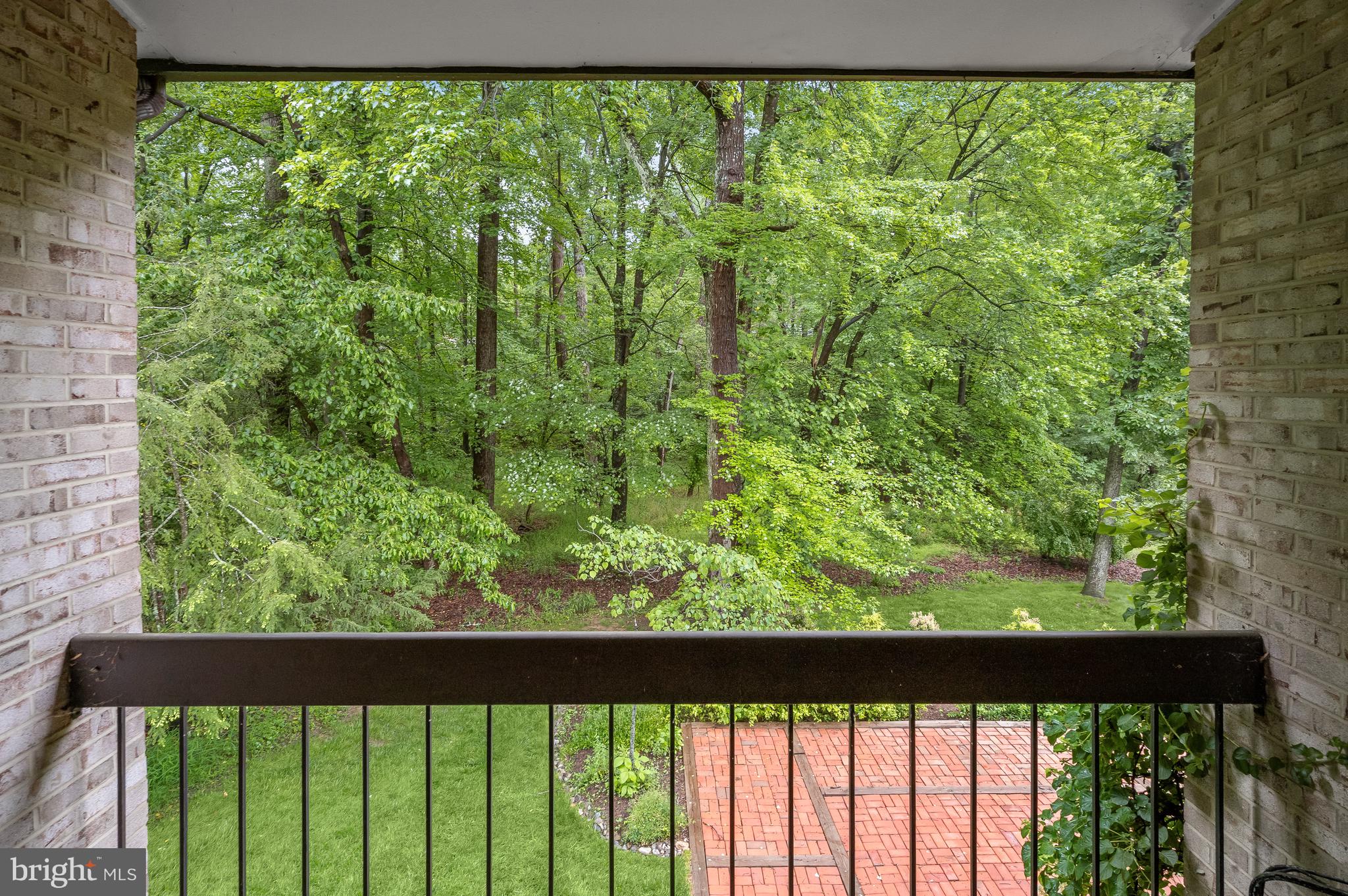 8805 Quiet Stream Court Potomac, MD 20854 - Photo 17 of 42 a view of a green yard from a balcony
