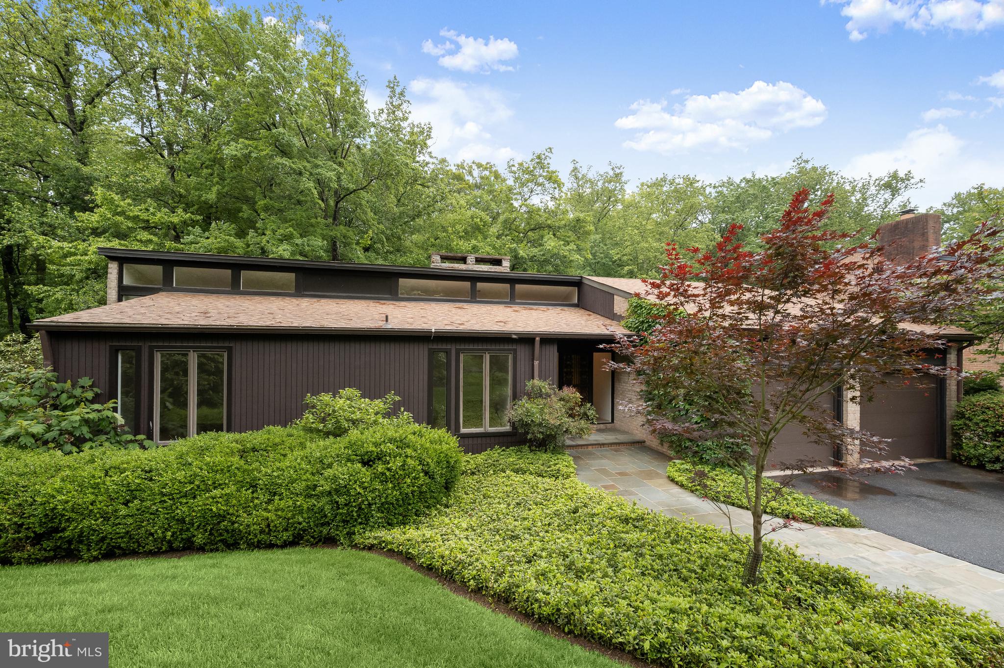 8805 Quiet Stream Court Potomac, MD 20854 - Photo 2 of 42 a view of a house with a garden