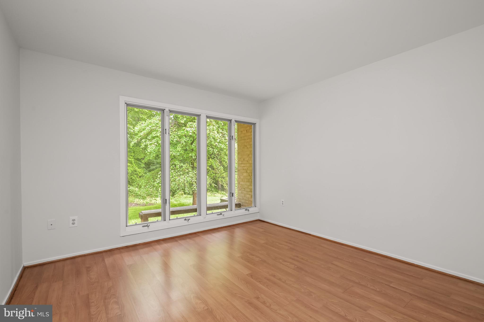 8805 Quiet Stream Court Potomac, MD 20854 - Photo 33 of 42 a view of a room with wooden floor and a window