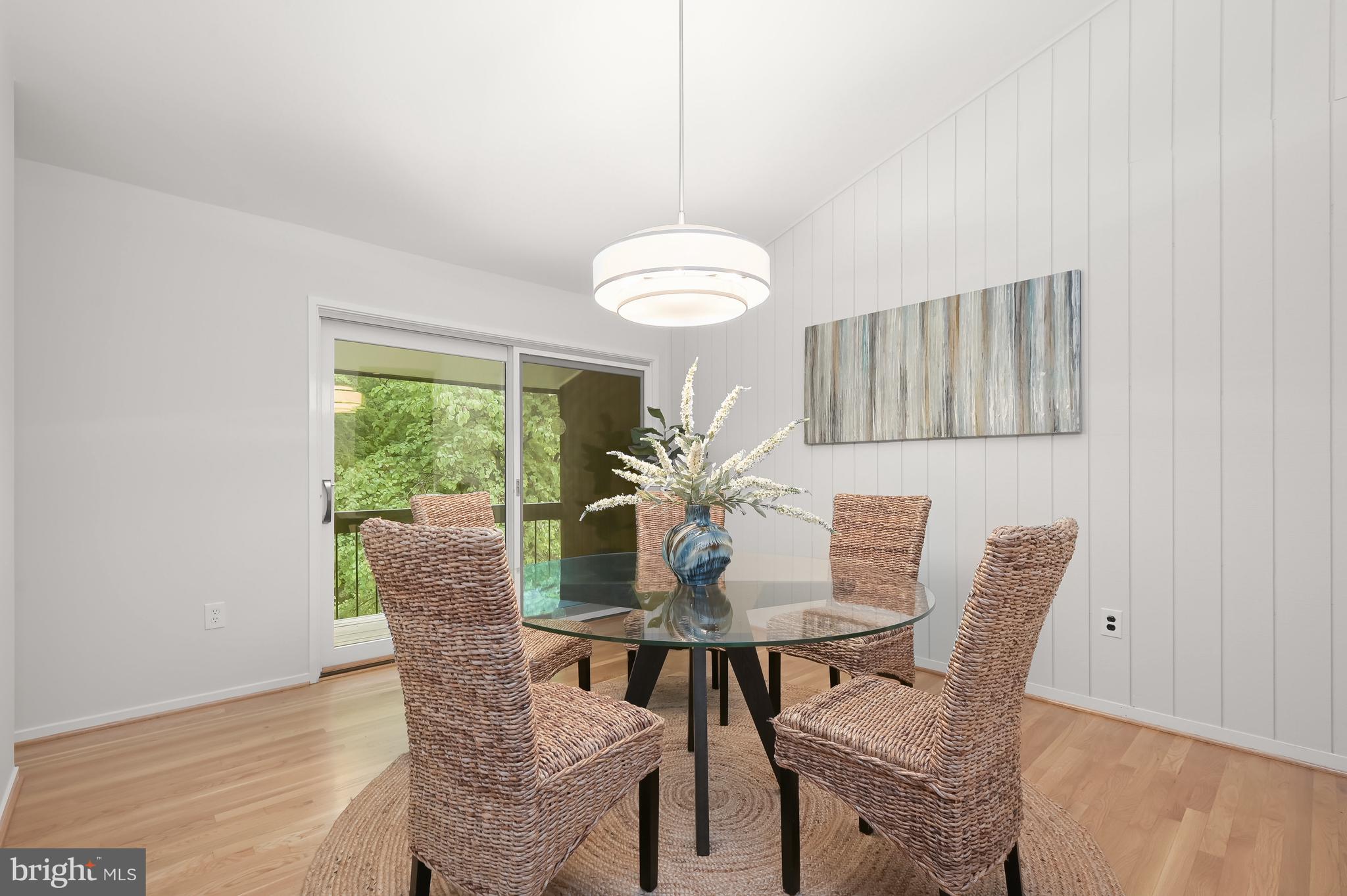8805 Quiet Stream Court Potomac, MD 20854 - Photo 9 of 42 a view of a dining room with furniture and wooden floor