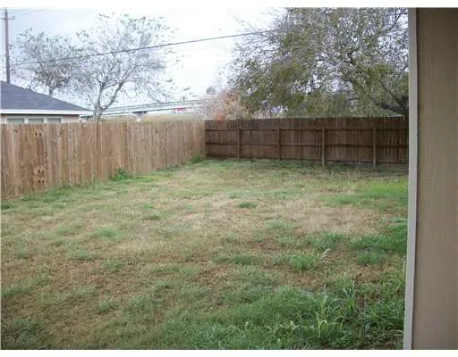 a view of backyard with green space