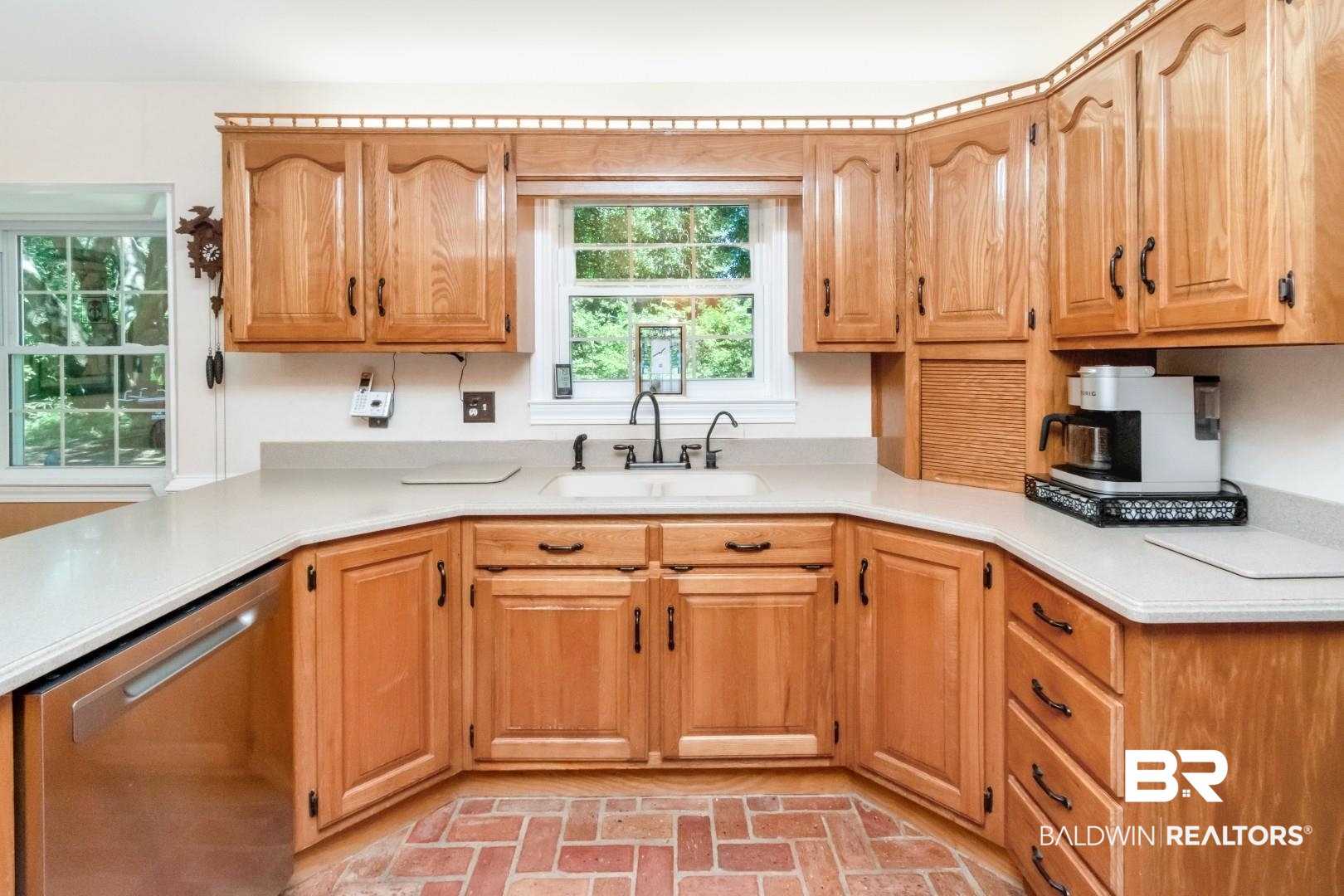 8220 Fordham Road Mobile, AL 36619 - Photo 4 of 41 Kitchen with light countertops, a sink, brick floor, and stainless steel dishwasher