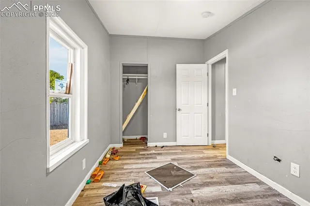 a view of a livingroom with furniture and windows