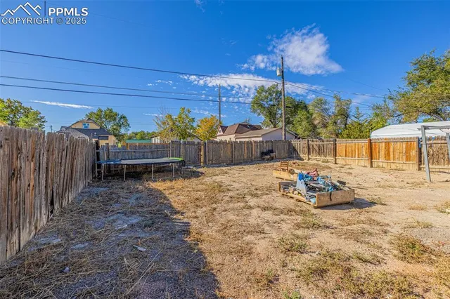 a wooden bench sitting in front of a house