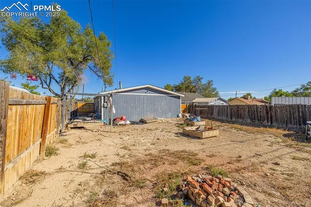 a view of a backyard of the house