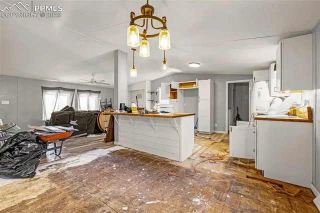 a view of kitchen and dining room with wooden floor